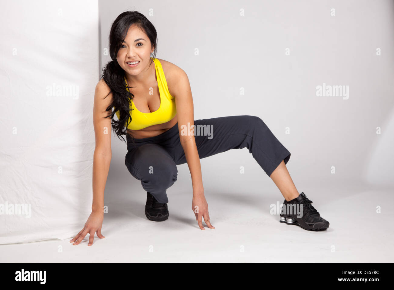 Pretty Hispanic lady wearing work out clothes and posing Stock Photo