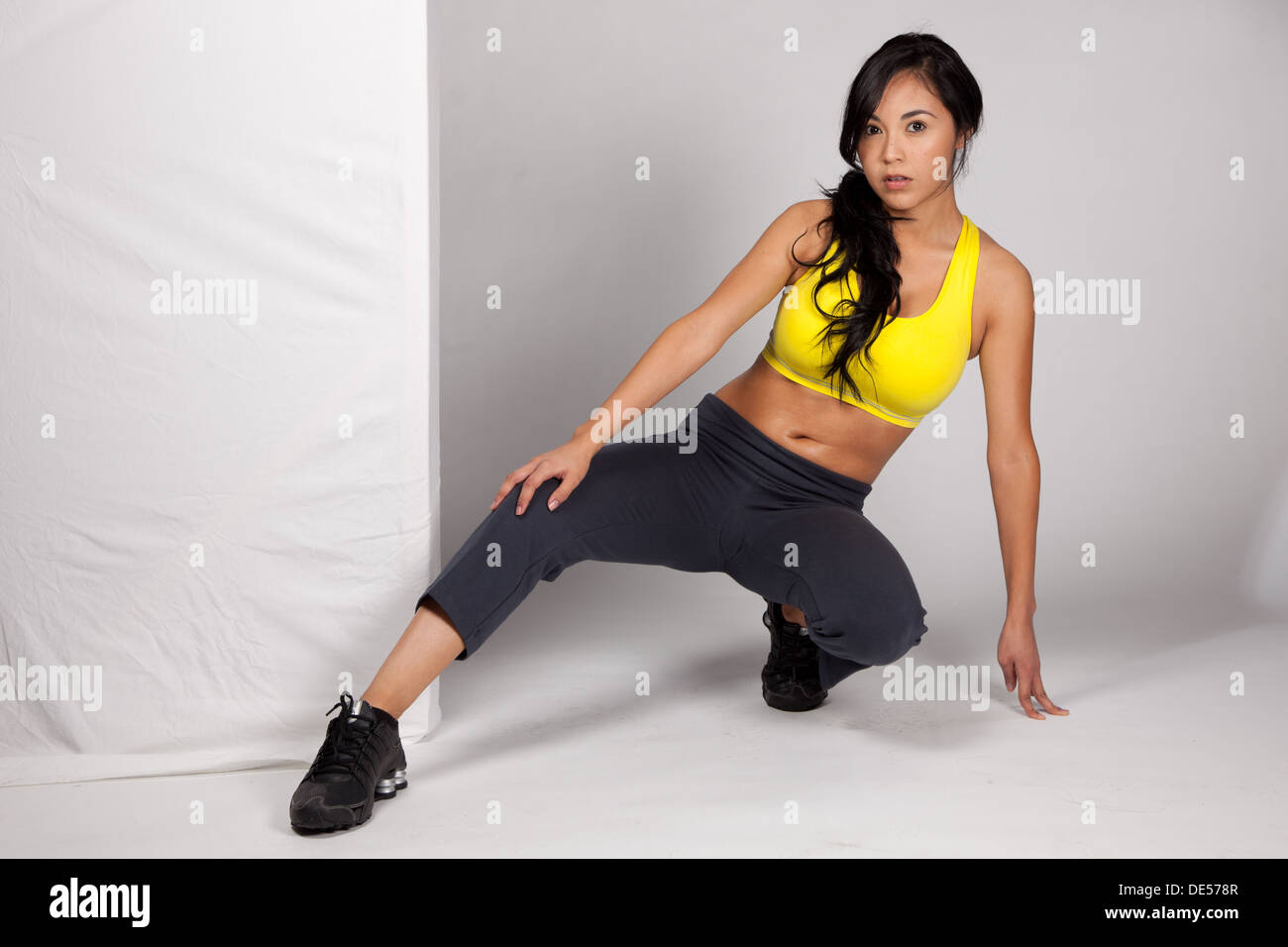 Pretty Hispanic lady wearing work out clothes and posing Stock Photo