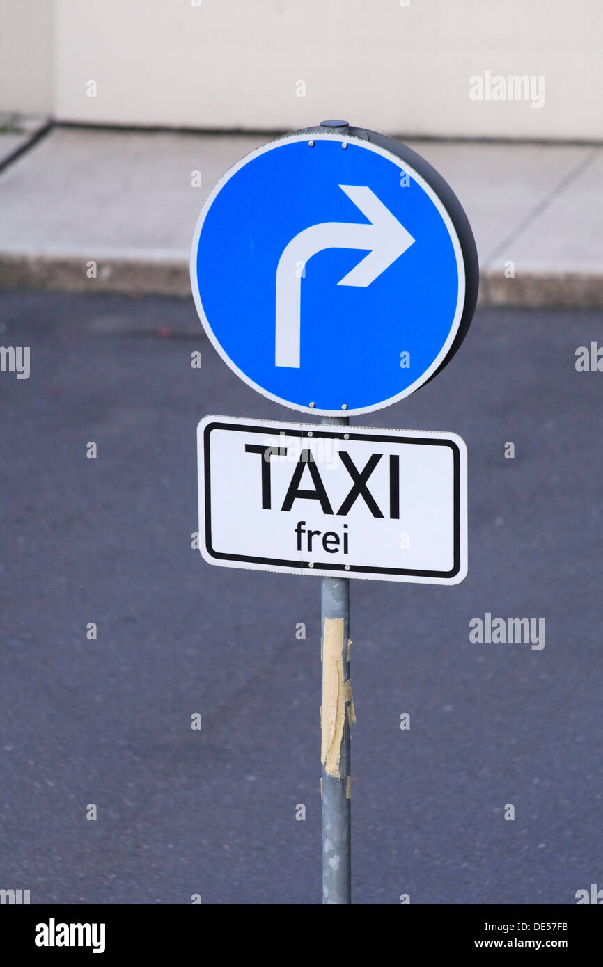 Traffic sign, arrow, right turn only, taxis excepted Stock Photo