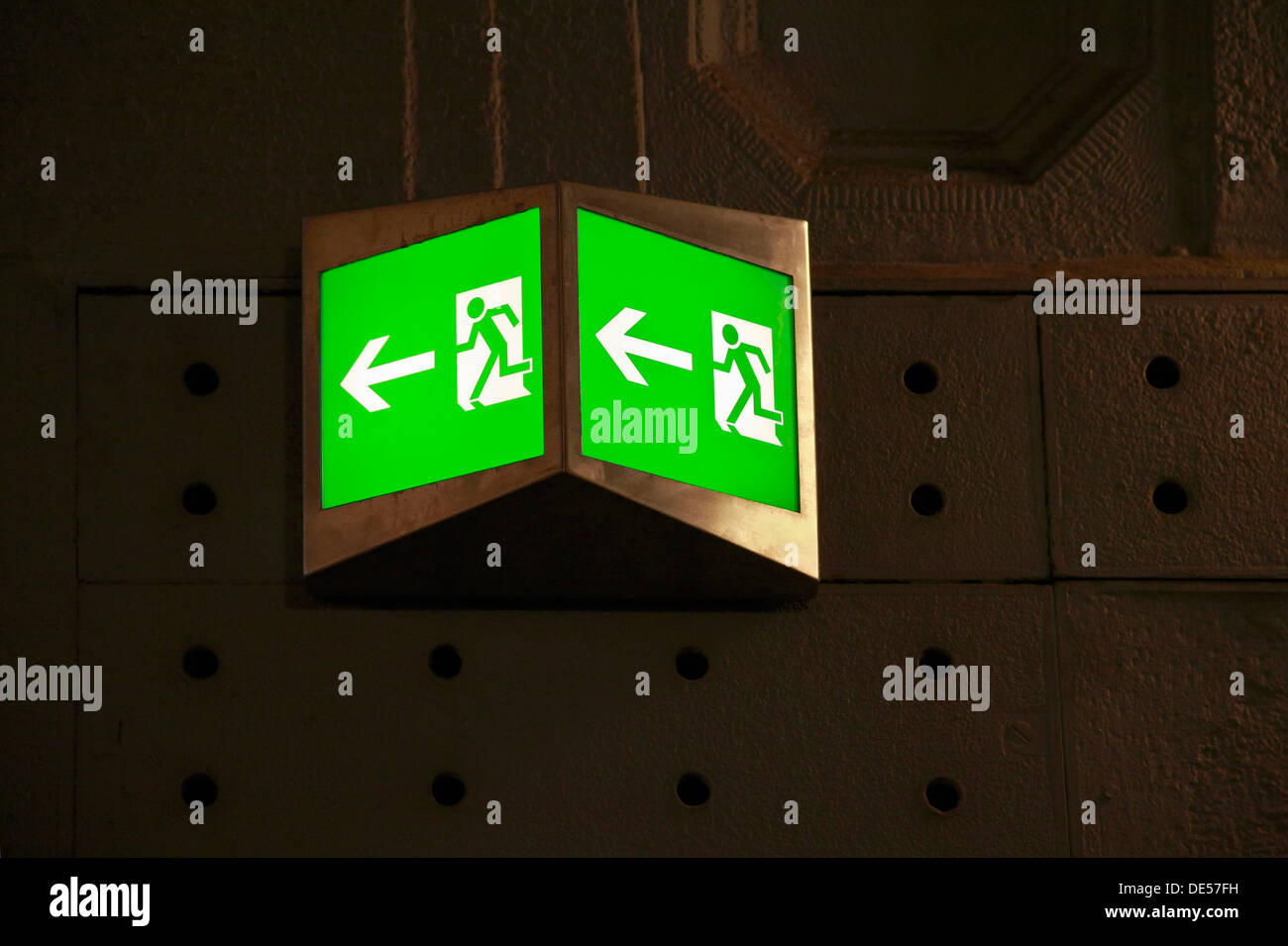 Emergency exit sign, illuminated pictograms, green, fire prevention, evacuation route Stock Photo