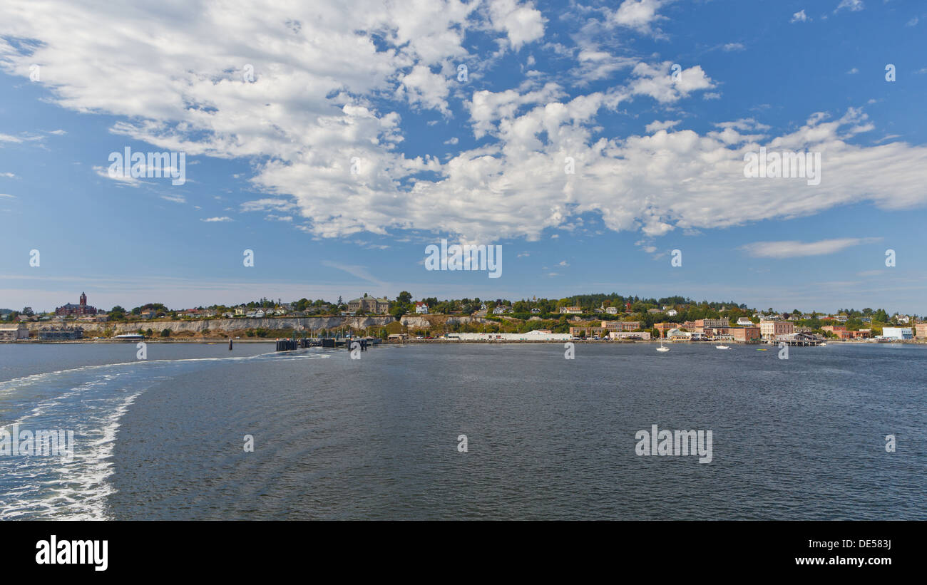 View from the back of the ferry, leaving Port Townsend waterfront on a summer day. Stock Photo