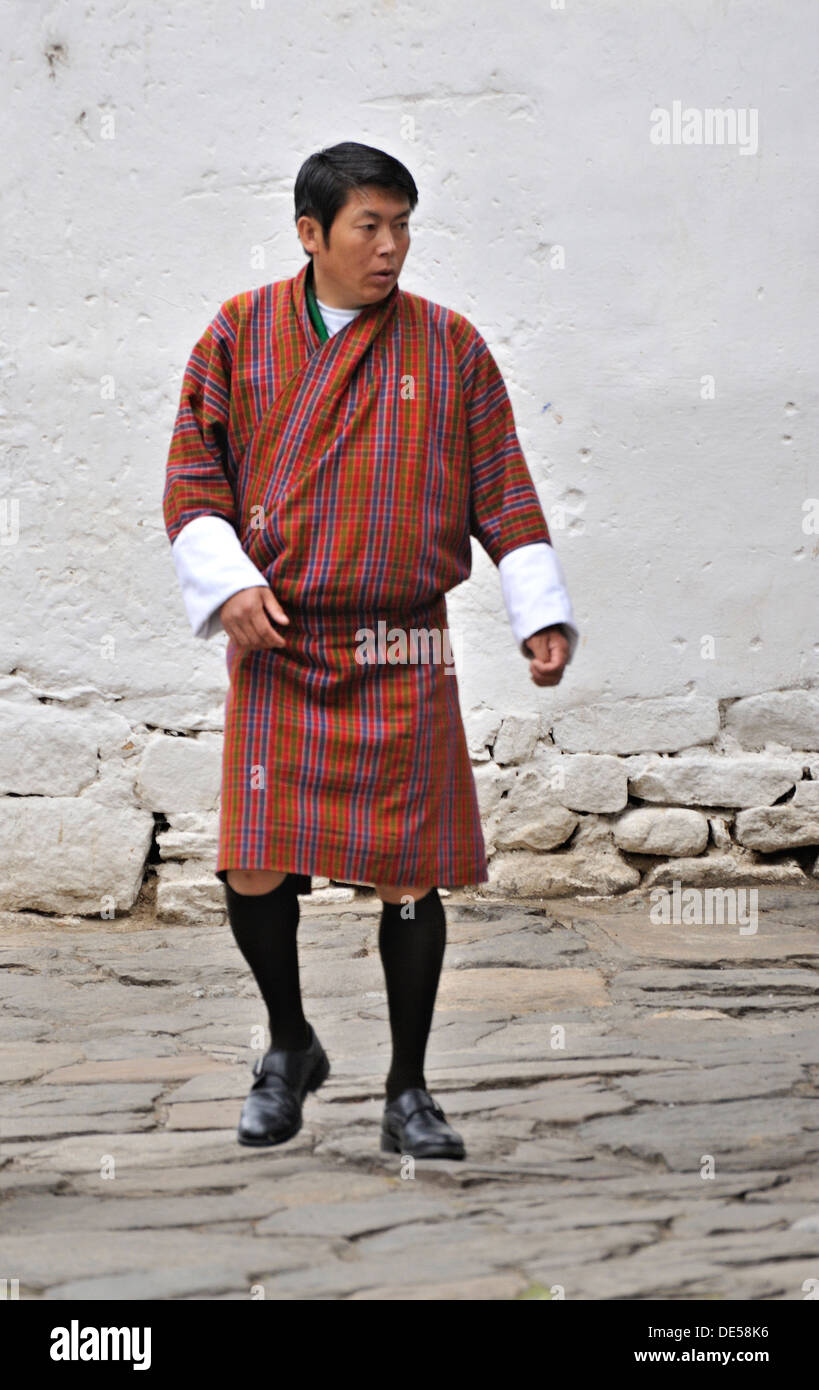 Man wearing traditional outfit called gho, Paro, Bhutan Stock Photo