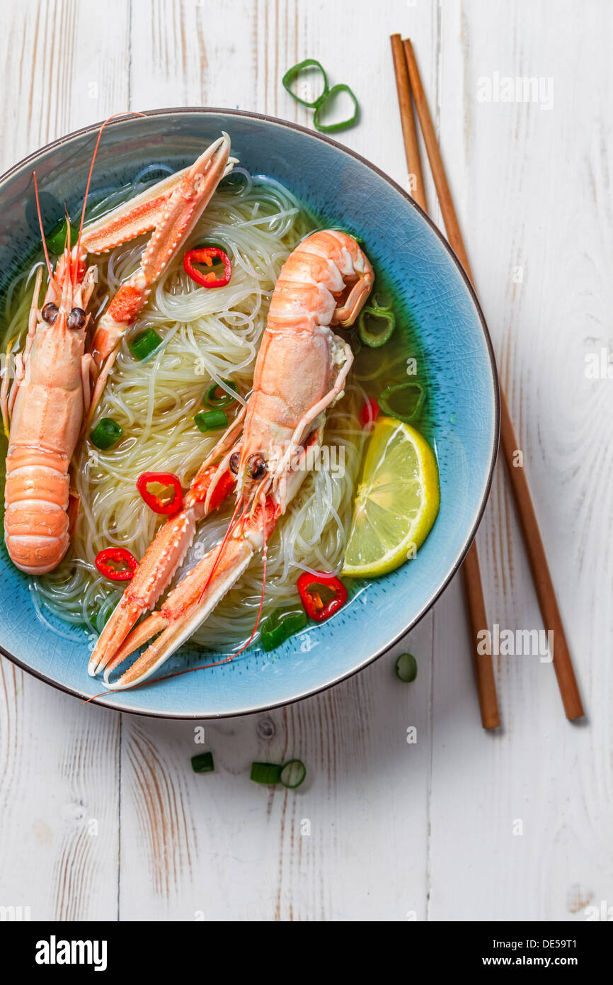 Traditional Thai soup with scampi and noodles Stock Photo