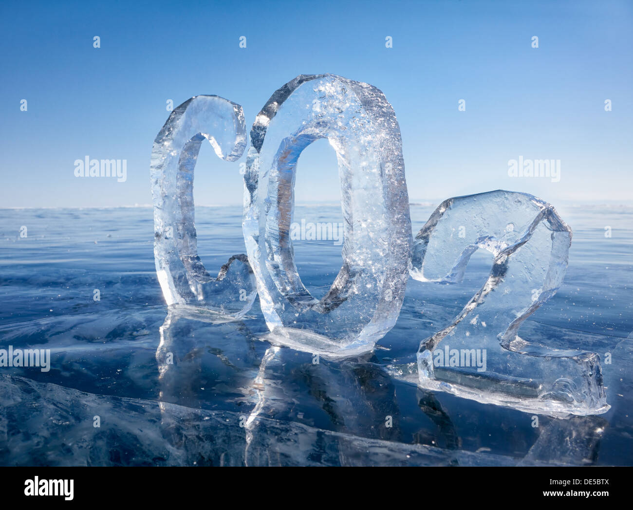 Chemical formula of greenhouse gas carbon dioxide CO2 made from ice on winter frozen lake Baikal under blue sky Stock Photo