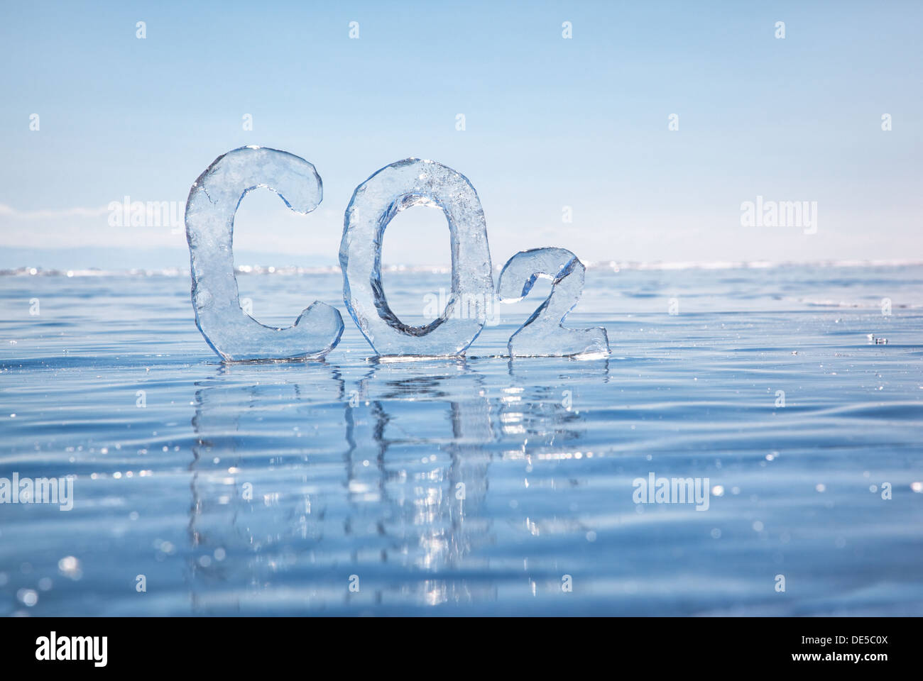 Chemical formula of greenhouse gas carbon dioxide CO2 made from ice on winter frozen lake Baikal under blue sky  Stock Photo