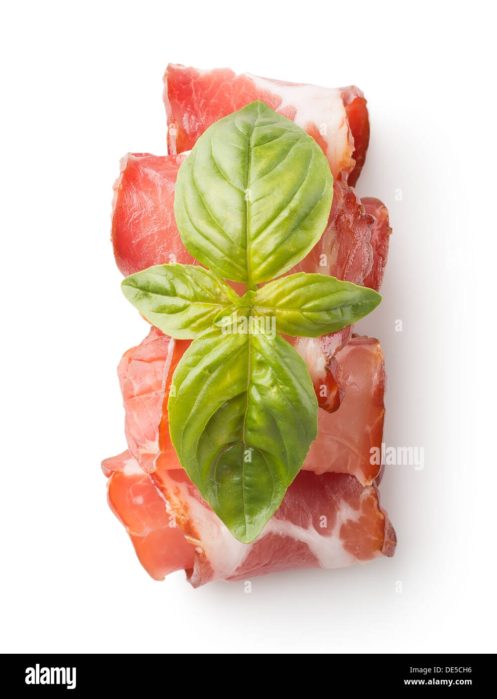 Appetizing bacon with herbs isolated on a white background Stock Photo