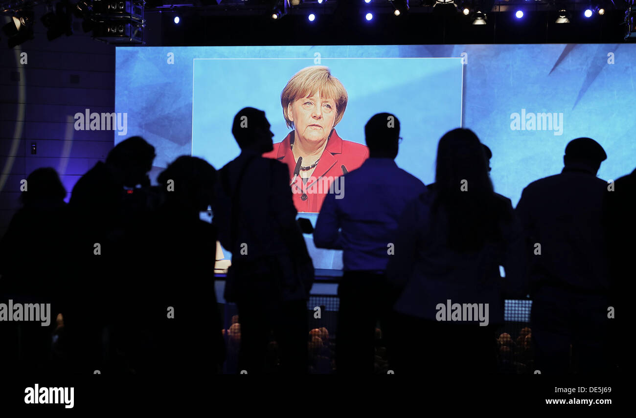 Frankfurt Main, Germany. 12th Sep, 2013. German Chancellor Angela Merkel speaks at the opening ceremony of the International Motor Show (IAA) and the speech is displayed on a screen in Frankfurt Main, Germany, 12 September 2013. Almost 1100 exhibitors from around the world present novelties at the world's largest automobile show IAA until 22 September 2013. Photo: FRANK RUMPENHORST/dpa/Alamy Live News Stock Photo
