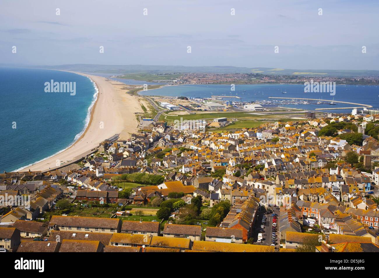 Chesil beach. Fleet lagoon and Portland harbour looking north from