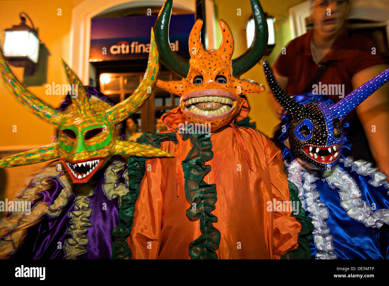 Children costumed revelers called a vejigante in the streets during the Carnaval de Ponce February 21, 2009 in Ponce, Puerto Rico. Vejigantes are a folkloric character representing the devil. Stock Photo