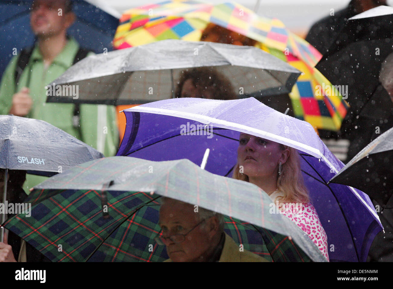 Duesseldorf, Germany, people are in bad weather under their Umbrellas Stock Photo