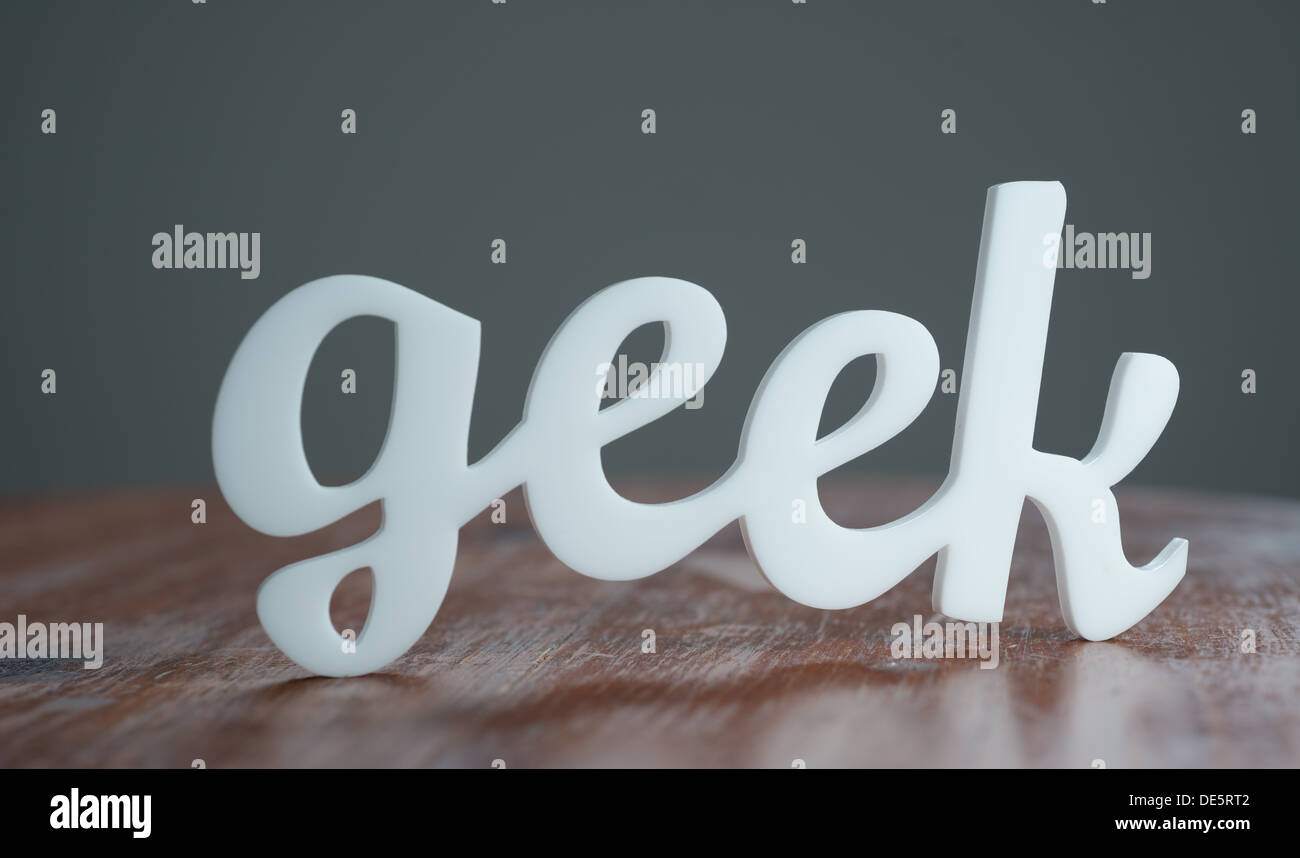 Geek on Wooden Table Stock Photo