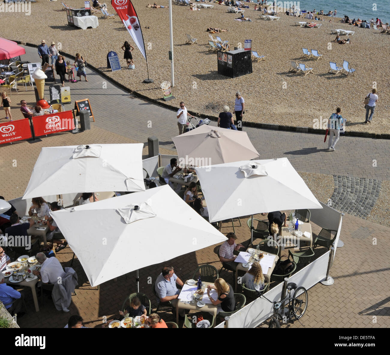 View down over beach side cafes to Brighton beach Brighton East Sussex England Stock Photo