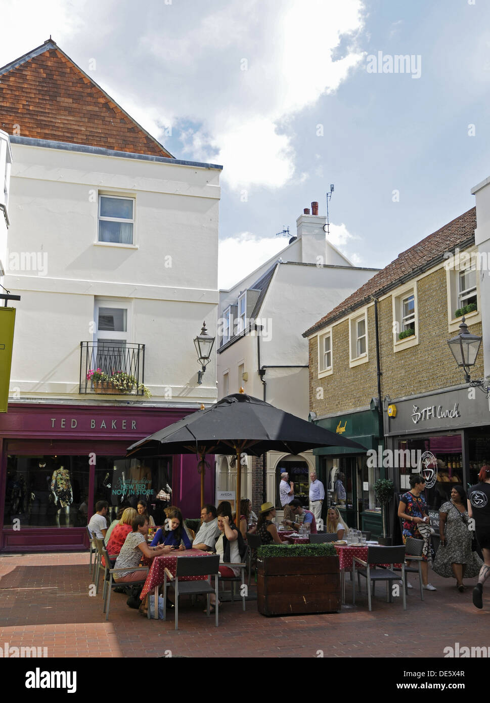 Shops and Cafe in Dukes Lane  with people eating Al Fresco Brighton East Sussex England Stock Photo