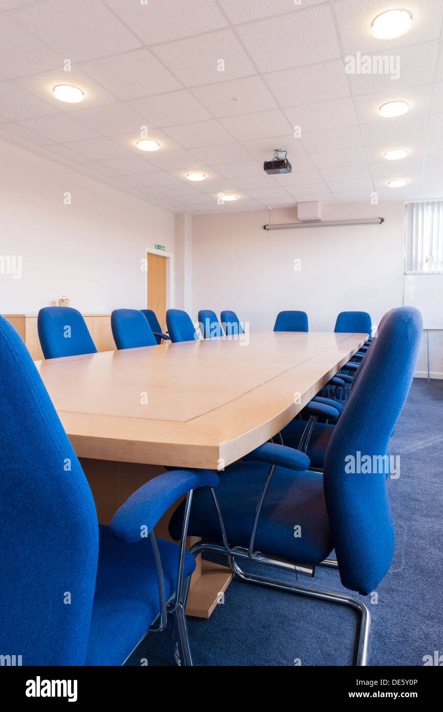 A typical boardroom / meeting room / conference room featuring a wall
