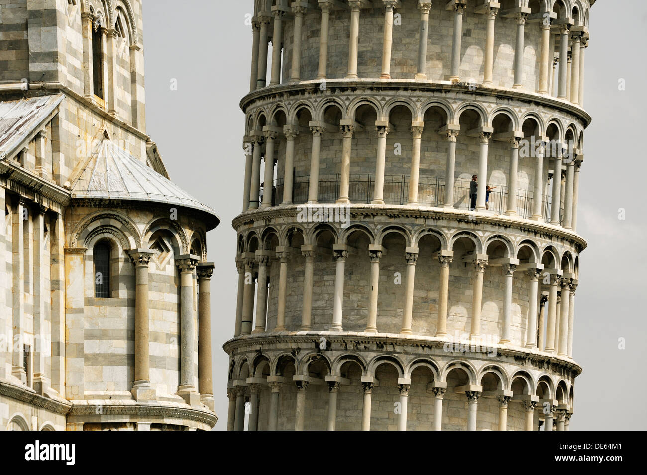 The Leaning Tower of Pisa angles away from the south transept of the Duomo in the Piazza dei Miracoli, Pisa, Tuscany, Italy Stock Photo