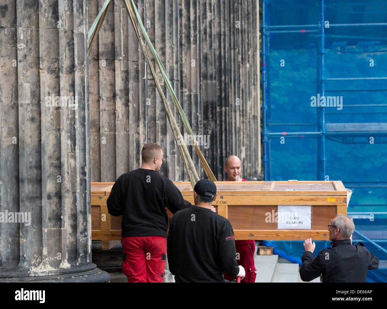 A wooden crate is transported by a crane in the entrance area of the Altes Museum at the Lustgarten in Berlin, Germany, 12 September 2013. The crate contains part of a transport from Lod, Israel and contains part of a Roman mosaic. The mosaic will be on display starting on 18 October 2013 as part of the exhibition 'Hunter and Hunted'. Photo: SOEREN STACHE Stock Photo