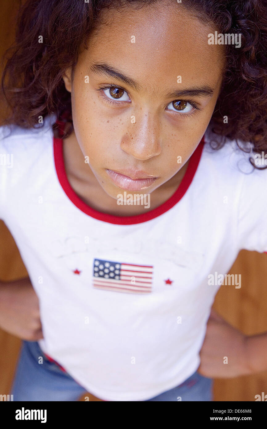 Young girl standing with hands on hips Stock Photo Alamy