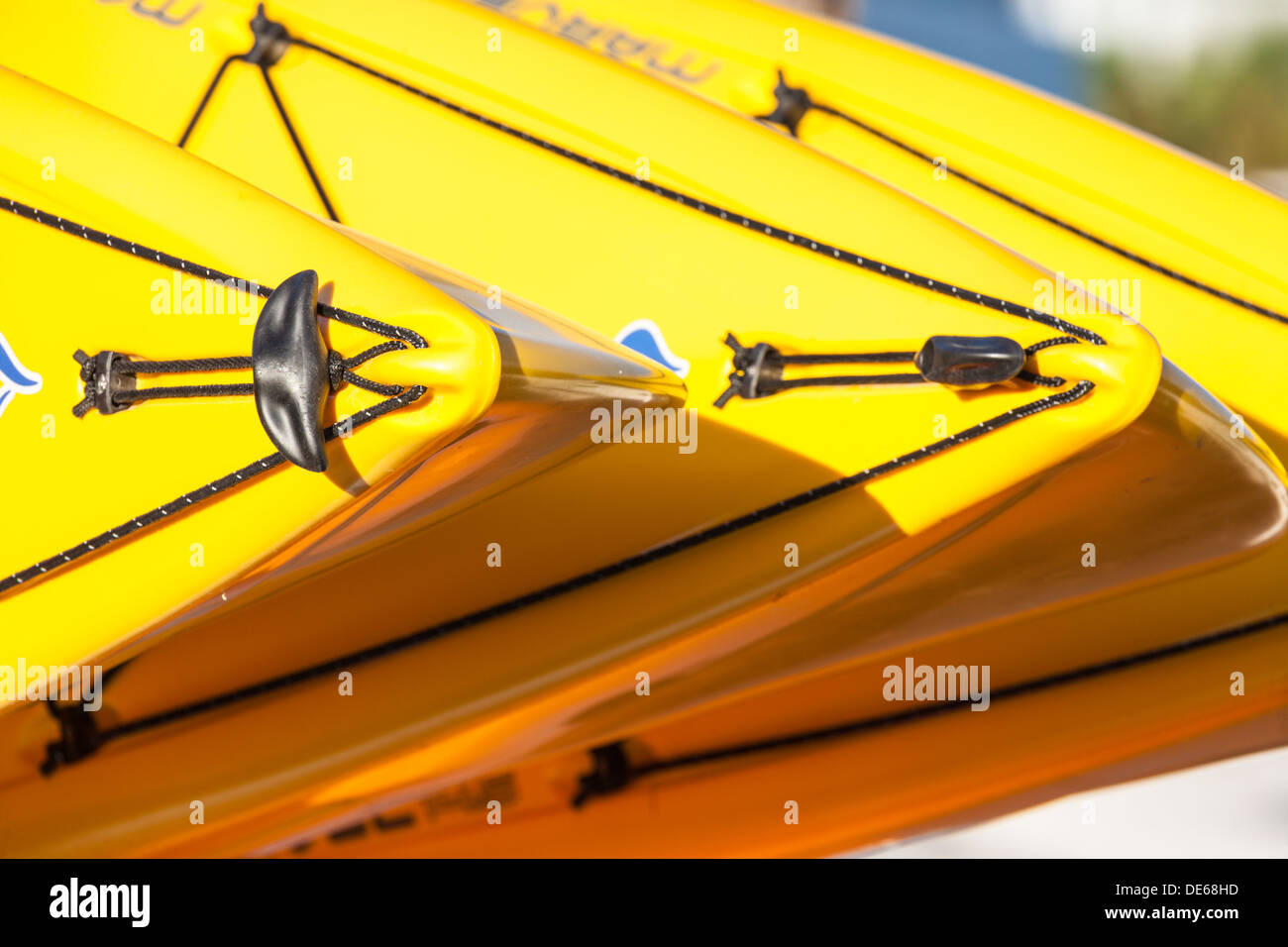 Yellow kayaks stacked for storage at rental center in Cedar Key, Florida Stock Photo