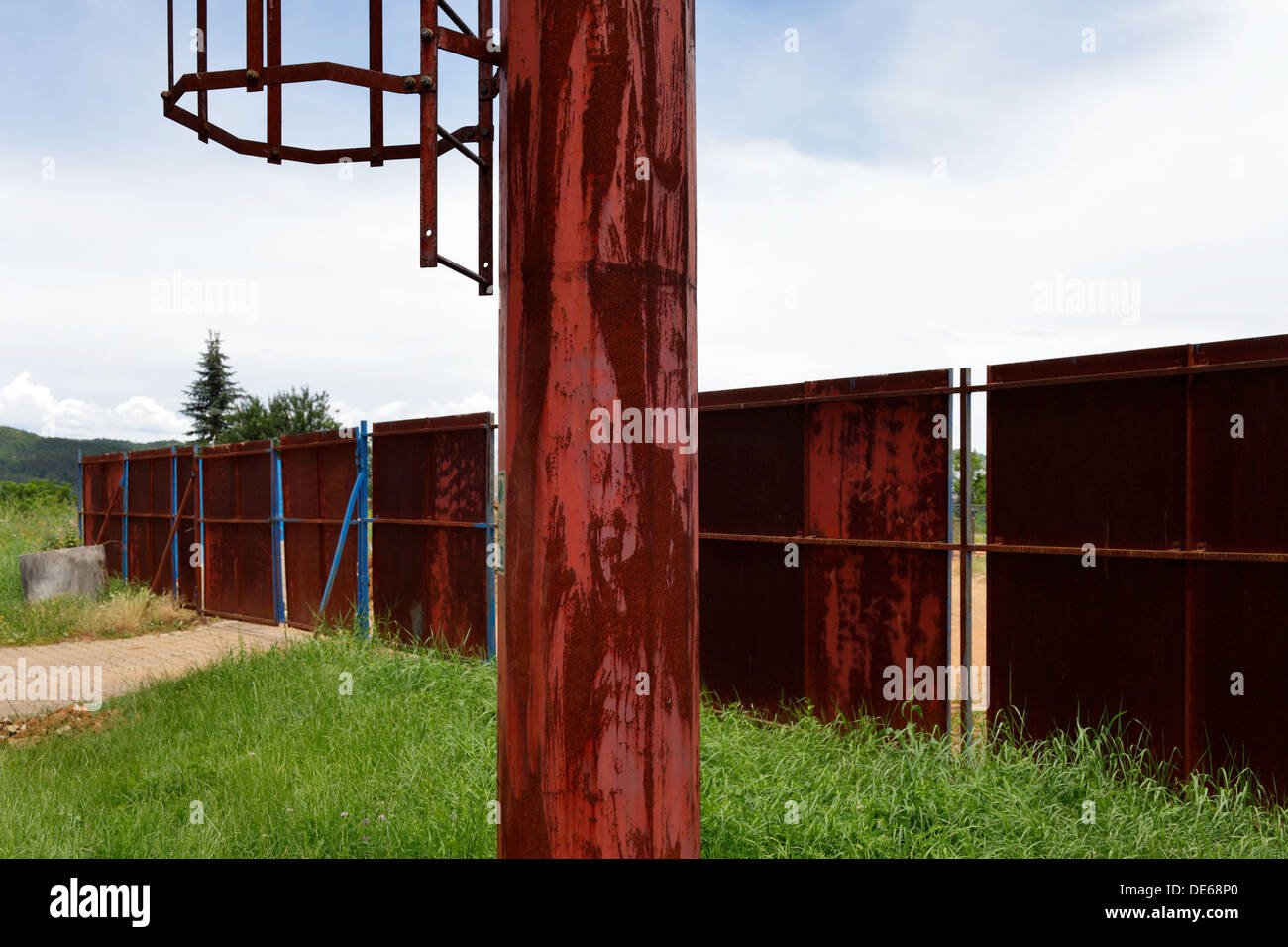 Zelena, Croatia, rusted pillars and fence at a sports stadium Stock Photo