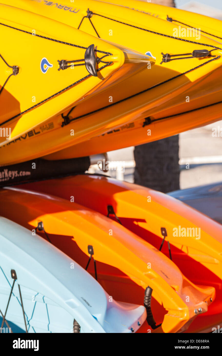 Yellow kayaks stacked for storage at rental center in Cedar Key, Florida Stock Photo