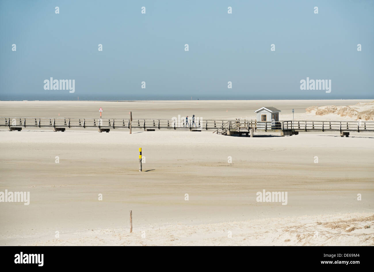 Sankt Peter- Ording, Germany, boardwalks and tourists on the beach of St. Peter- Ording Stock Photo