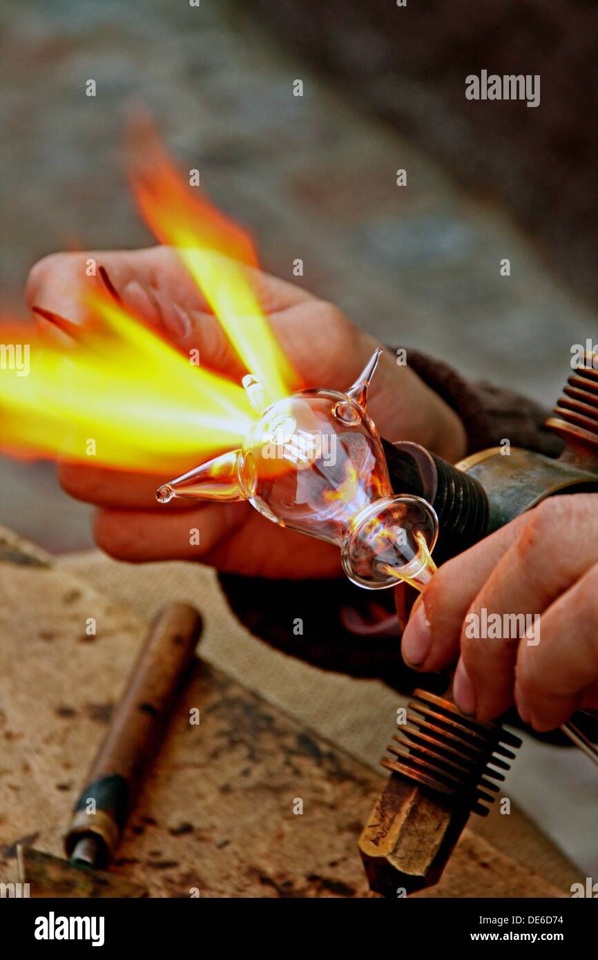 Craftsman, blowtorch, glass jug Stock Photo Alamy