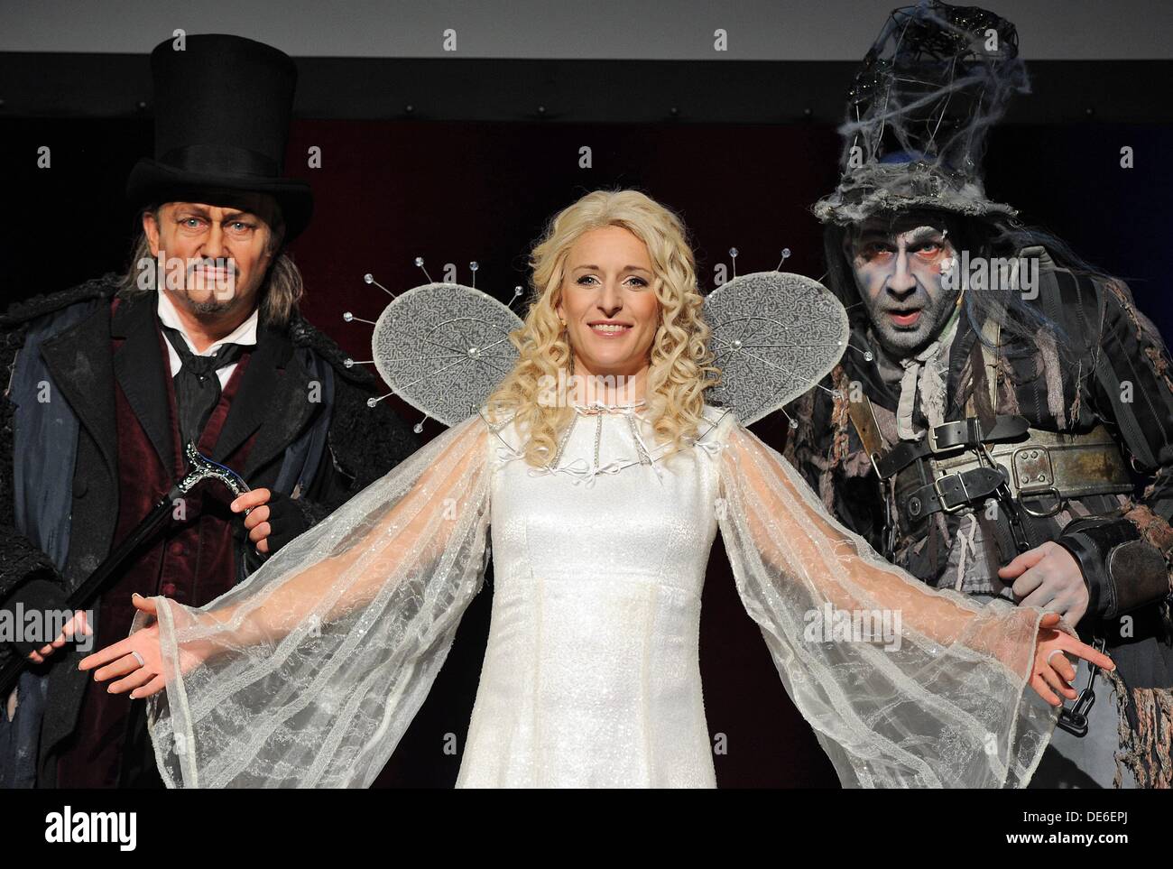 Singer Kristian Vetter (L) Stefanie Hertel (C) and Klaus Seiffert (R) pose  during the presentation of the musical 'Vom Geist der Weihnacht' (based on  Charles Dickens' A Christmas Carol) in Duesseldorf, Germany,