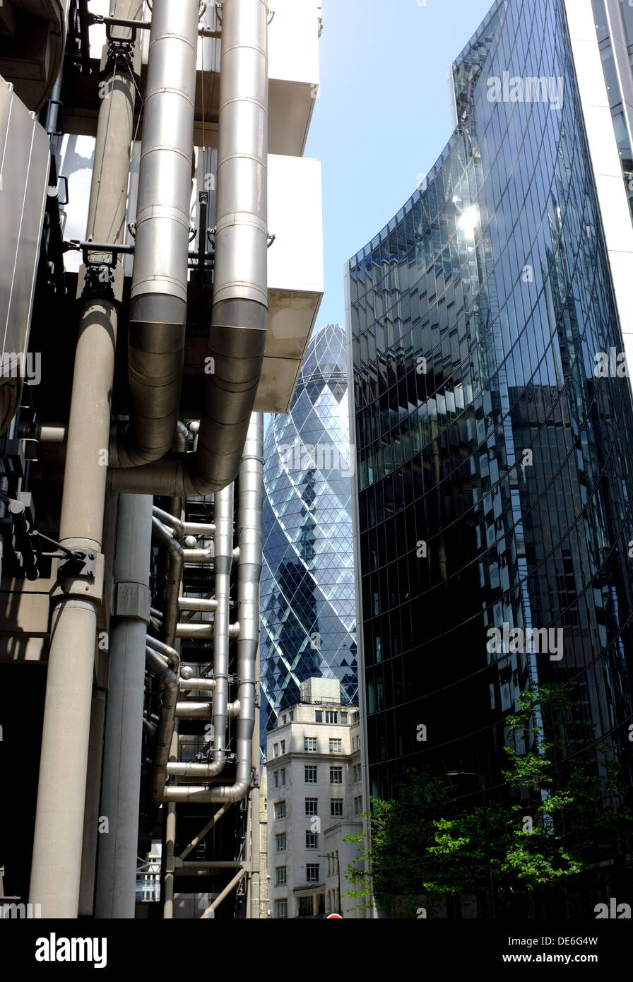 City of London landmark the Lloyds Building, designed by Richard Rogers frames the new Gherkin Stock Photo