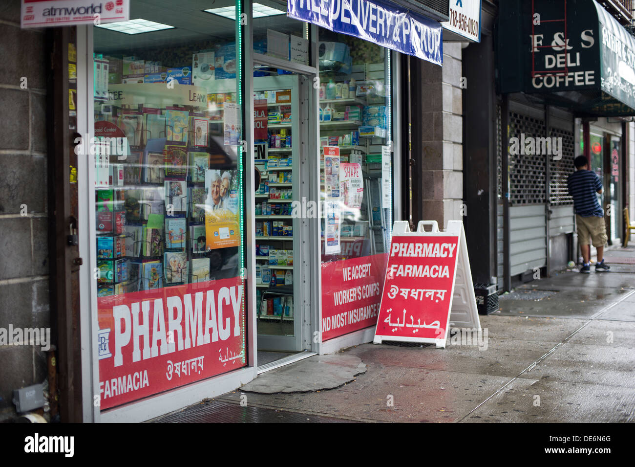 Multilingual signs for a pharmacy in Astoria, Queens in New York is