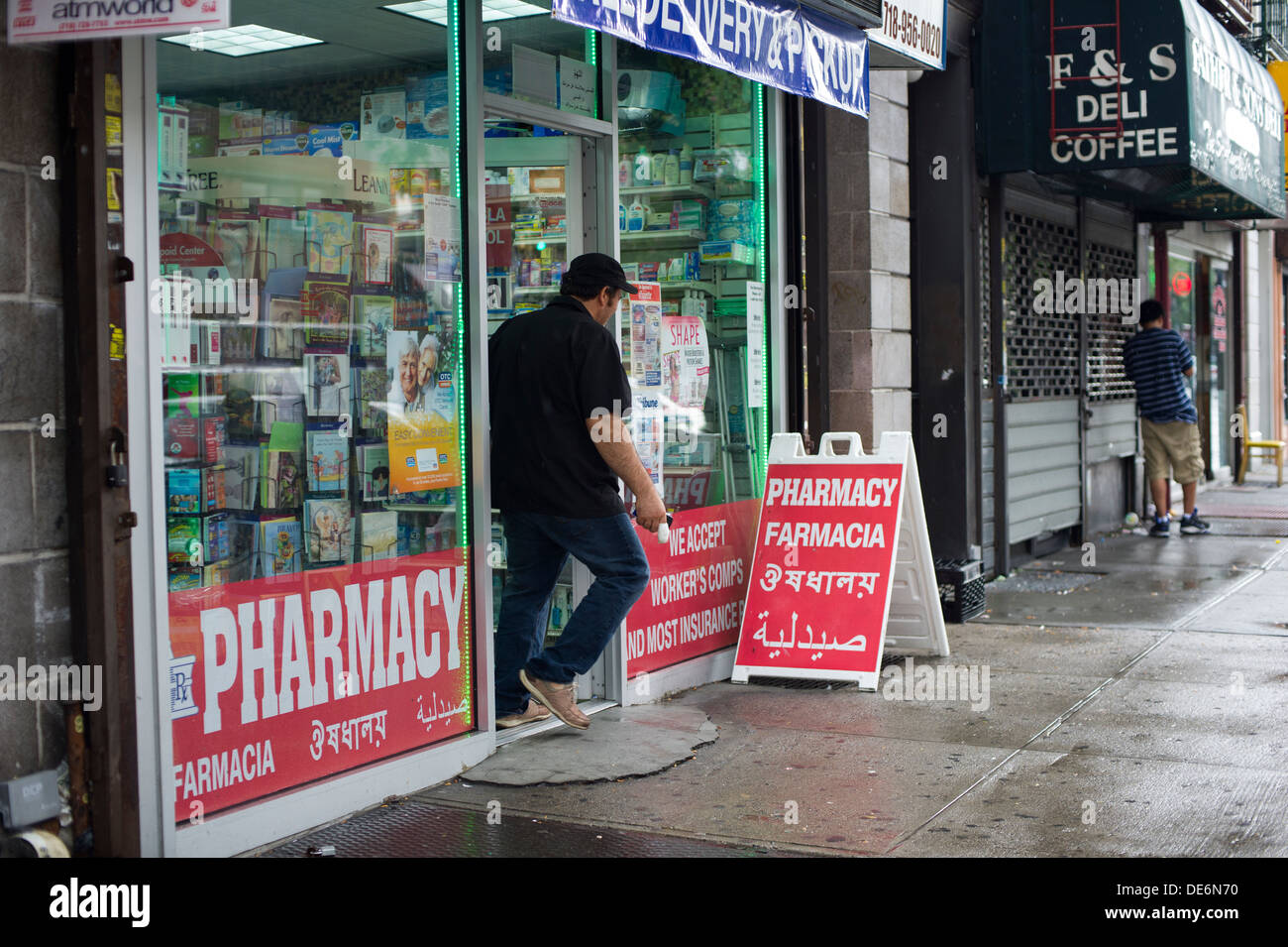 Multilingual signs for a pharmacy in Astoria, Queens in New York is