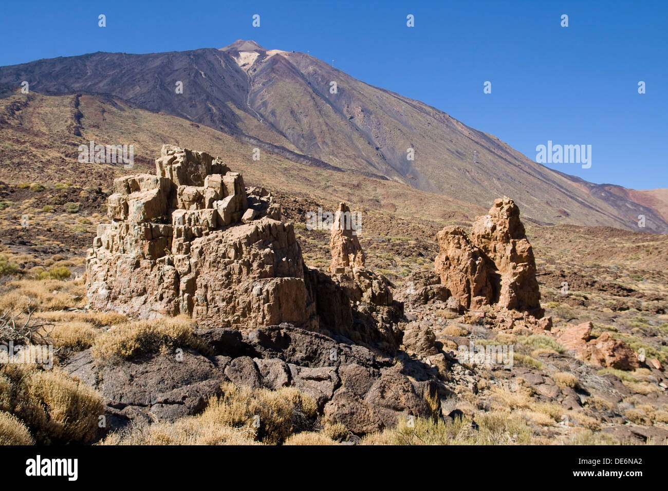 Rock formations with Mount Teide in the background, Tenerife, Canary Islands. Stock Photo