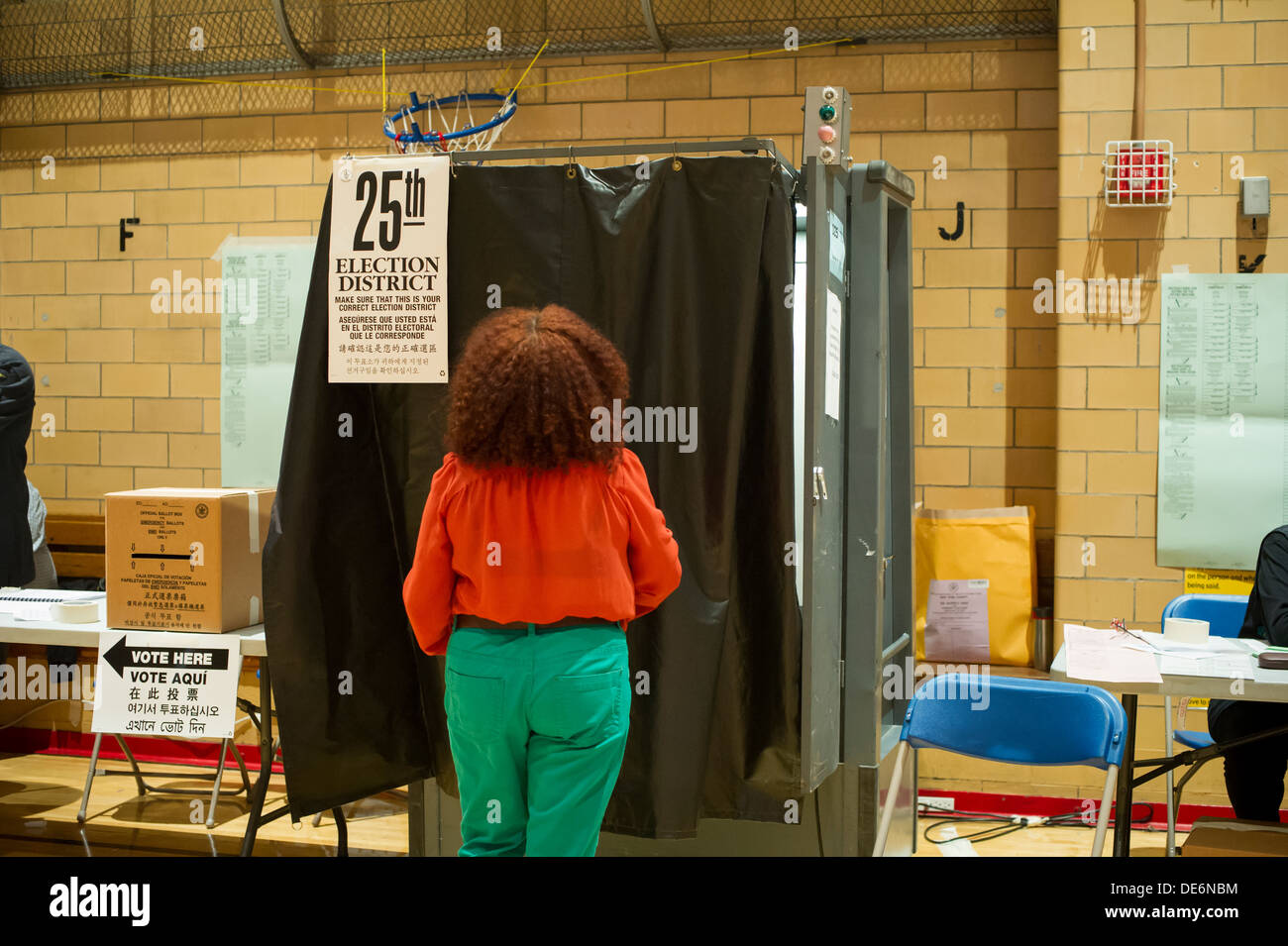 New Yorkers vote on Primary Day in the gym of PS 33 in the New York neighborhood of Chelsea on election day Stock Photo