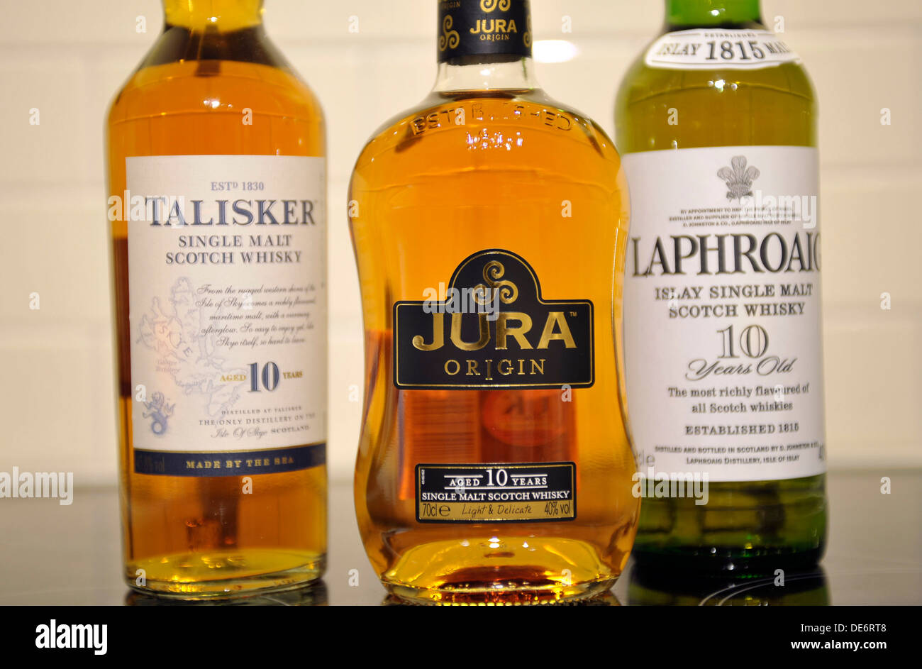 Bottles of Scottish single malt whiskeys. From left, Talisker, Jura and Laphroaig. Stock Photo