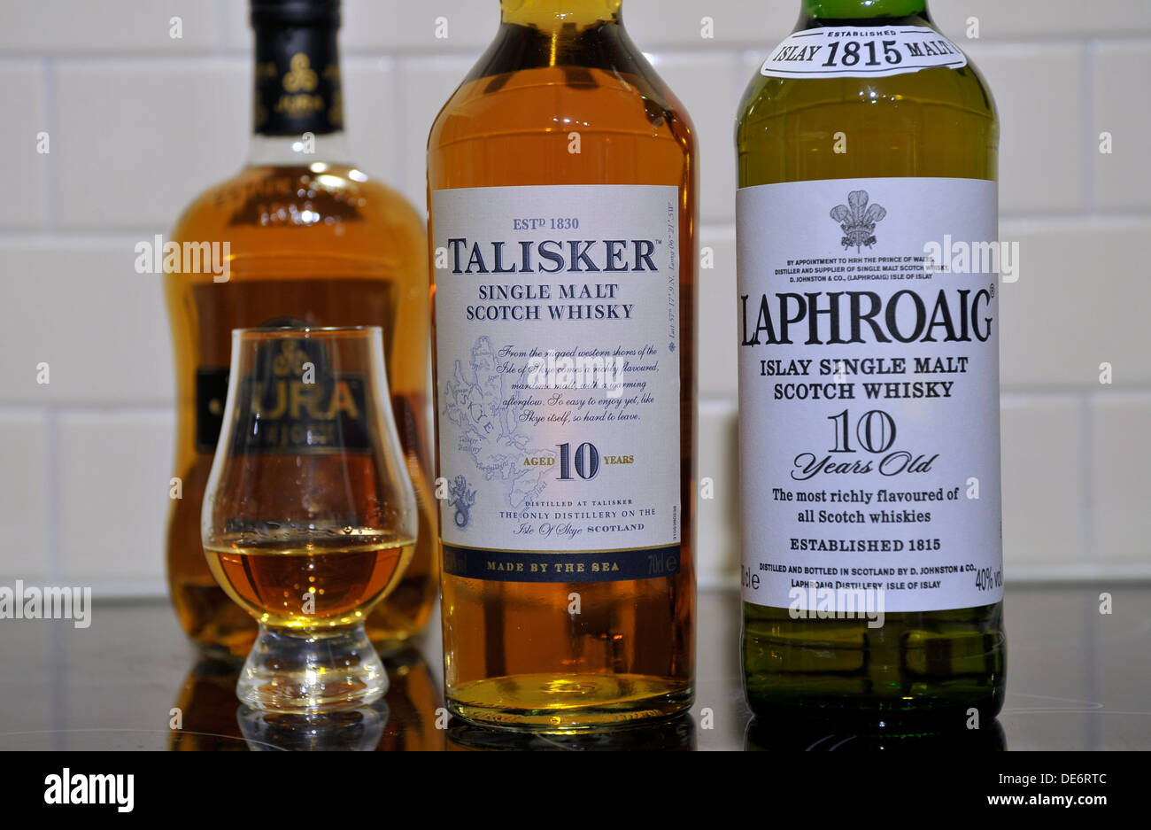 Bottles of Scottish single malt whiskies. From left, Jura, Talisker, Jura and Laphroaig. Stock Photo