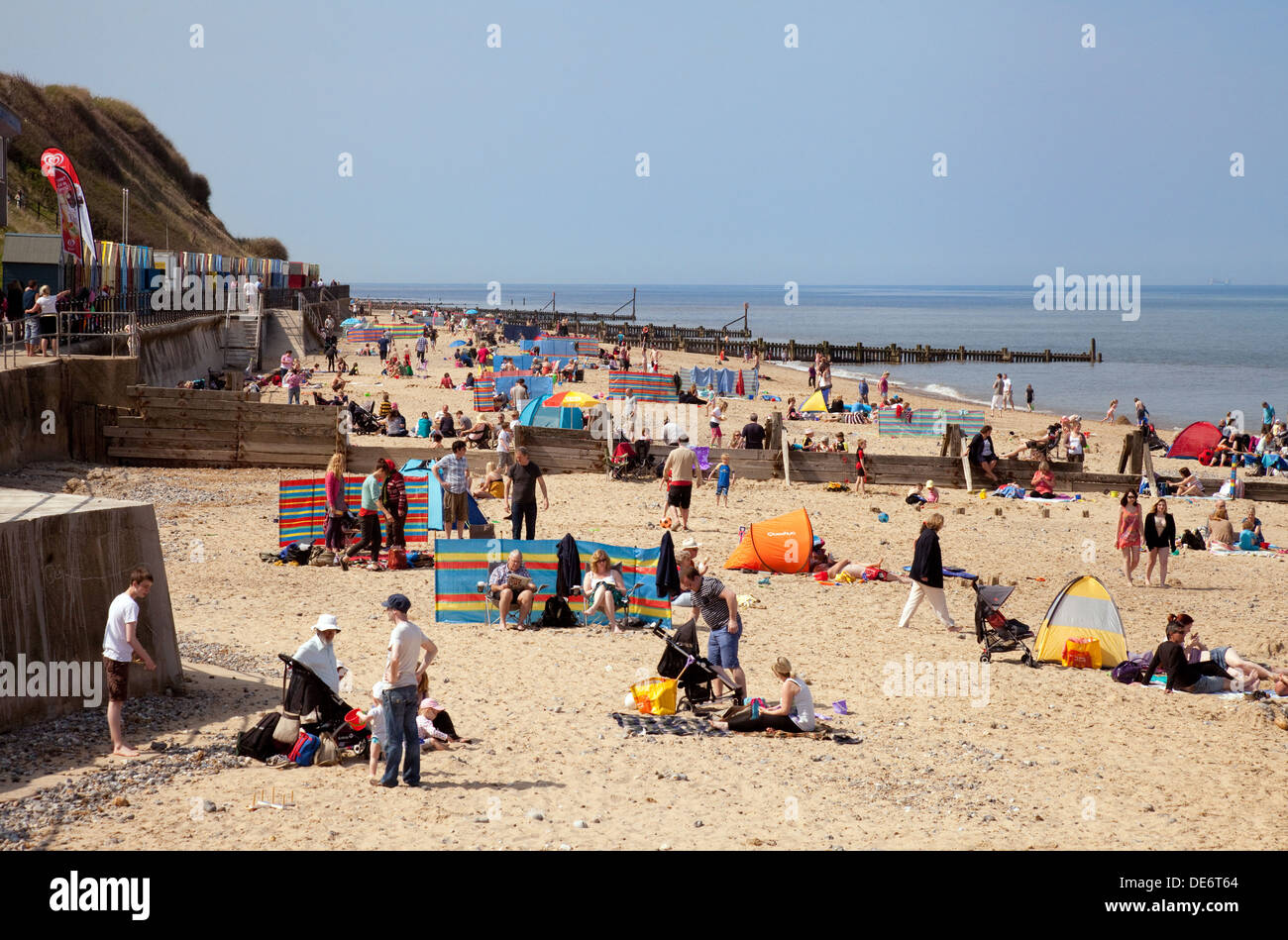 Crowded english beach scene, May Bank Holiday weekend; Mundesley beach, Norfolk coast, UK Stock Photo