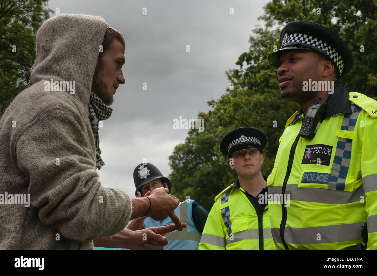 Balcombe,West Sussex, UK. 12th Sept, 2013. Environmental protester talks to Police Officer.. The anti fracking environmentalists are protesting against test drilling by Cuadrilla on the site in West Sussex that could lead to the controversial fracking process. Credit:  David Burr/Alamy Live News Stock Photo