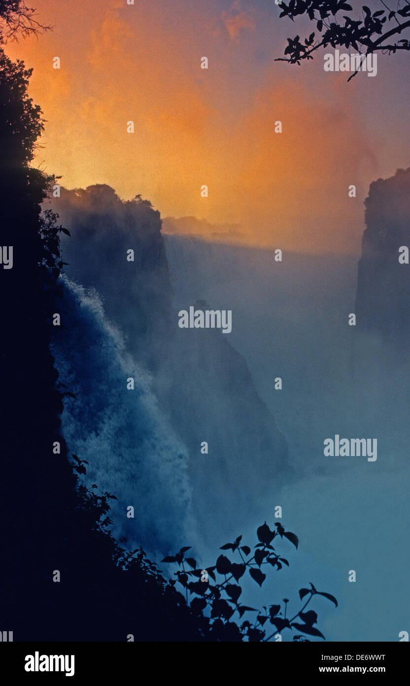 Light at dawn breaking over Devil's Cataract of Victoria Falls on Zimbabwe side. Stock Photo
