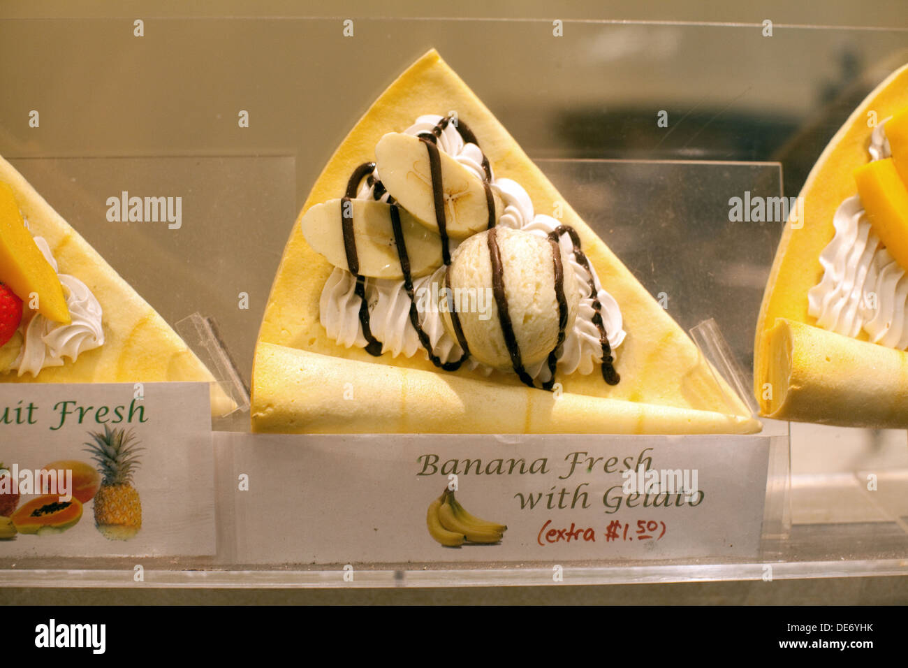 Display case selling fresh fruit crepe with banana and gelato.  A favorite Japanese style crepe dessert. Stock Photo
