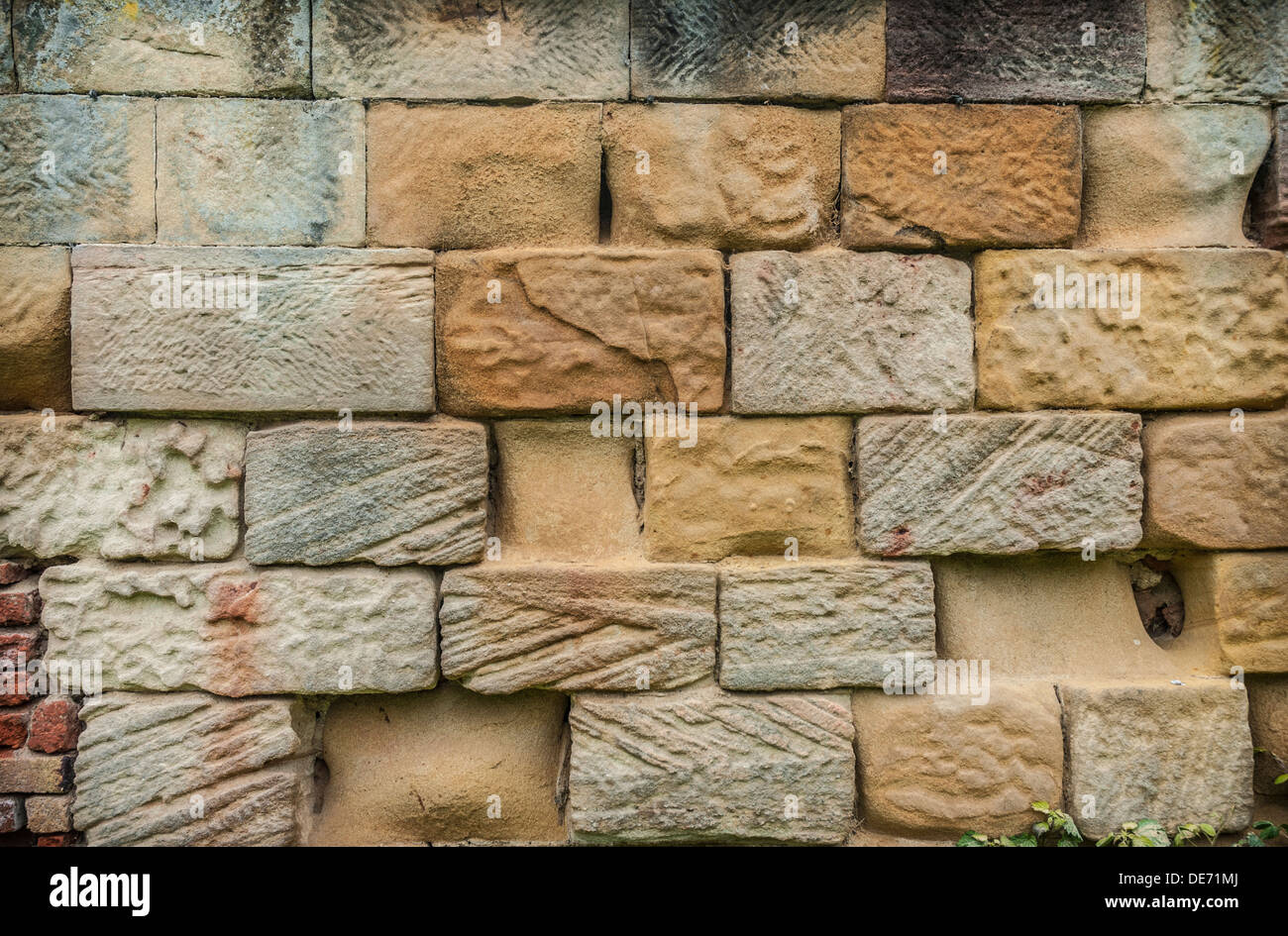 Eroded Sandstone brick Wall background. Stock Photo