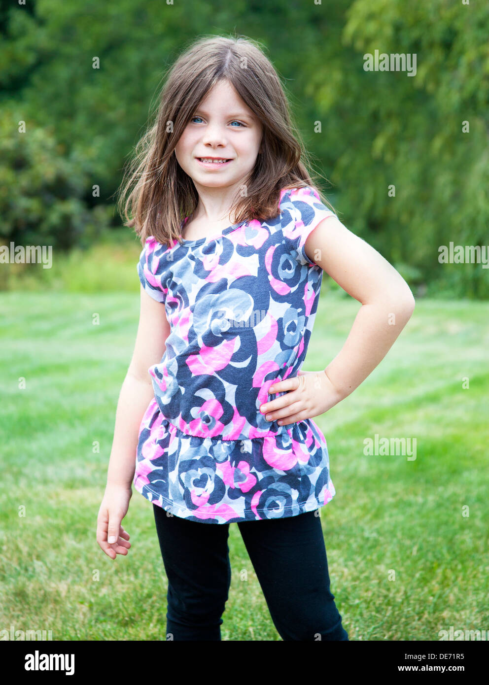 Pretty young girl portrait smiling outdoors Stock Photo