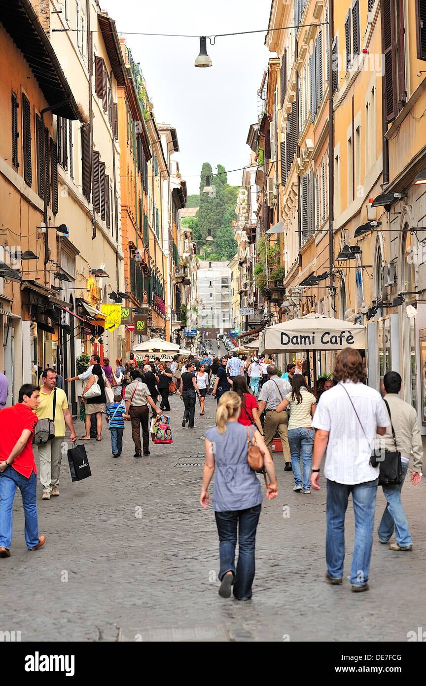Vertical view of a shopping street in Rome, with people walking and