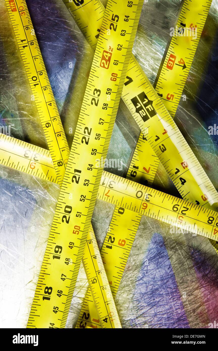 Still life of yellow tape measure rulers Stock Photo Alamy