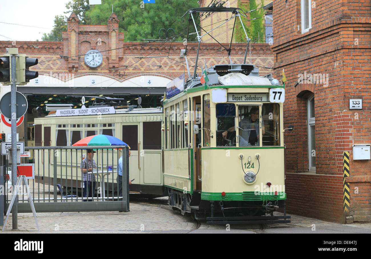 A motor tram of the series 124 exits the museum depot 'Sudenburg' in Magdeburg, Germany, 08 September 2013. Tram fans run a museum depot and offer visits of old trams as well as special tours with the historical vehicles. Photo: JENS WOLF Stock Photo
