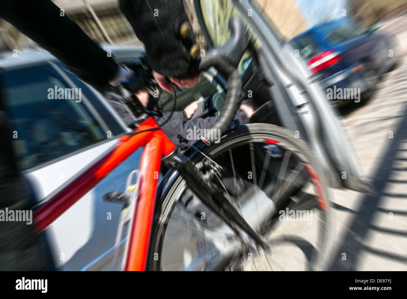 Berlin, Germany, cyclists collide with an opening Autotuer Stock Photo