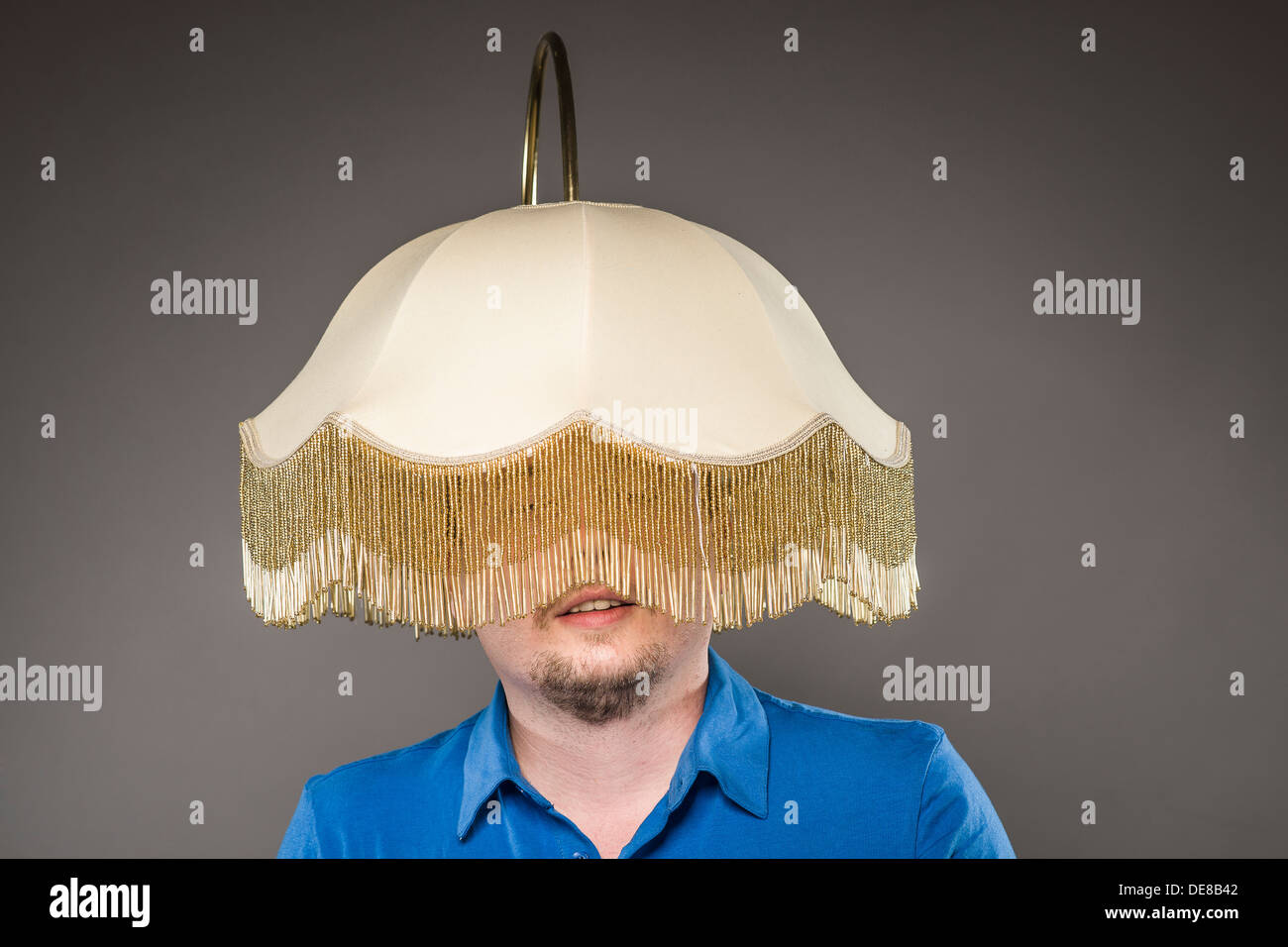Mid adult man with electric lamp, close up Stock Photo