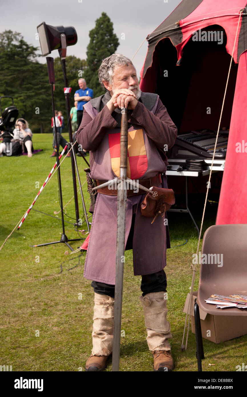 Medieval warrior resting on his sword at the Bruce Festival, Dunfermline, Scotland. Stock Photo