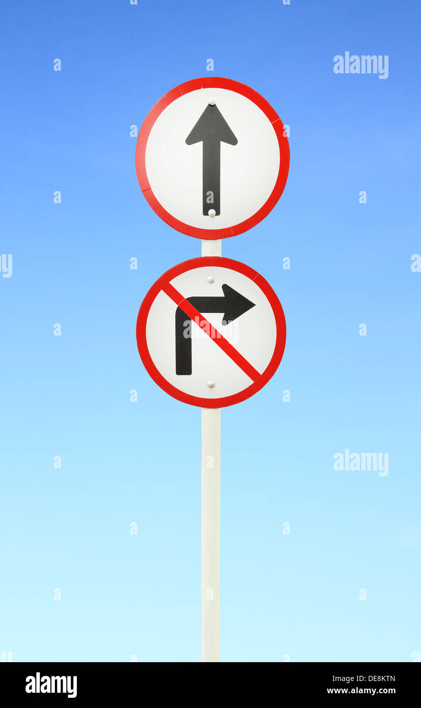 go ahead the way ,forward sign and don't turn right sign with blue sky Stock Photo
