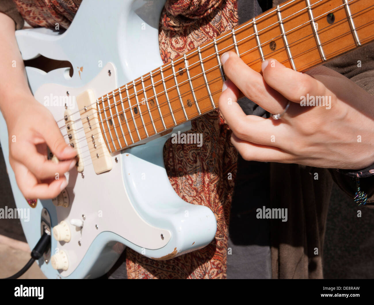 Street musician artist busker playing electric guitar Stock Photo Alamy