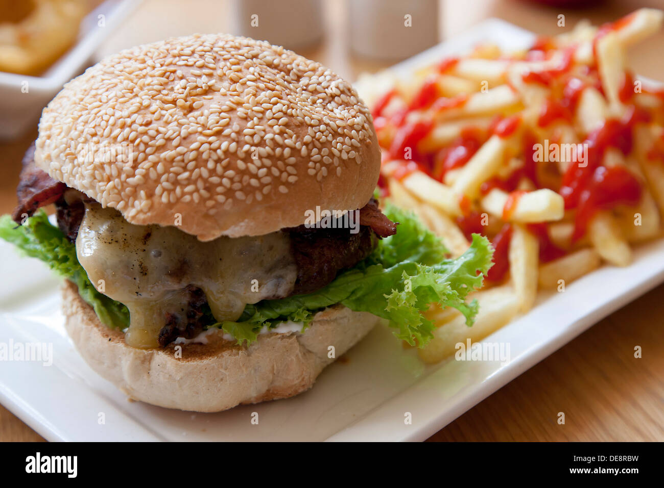 Beef And Bacon Burger And French Fries Stock Photo - Alamy