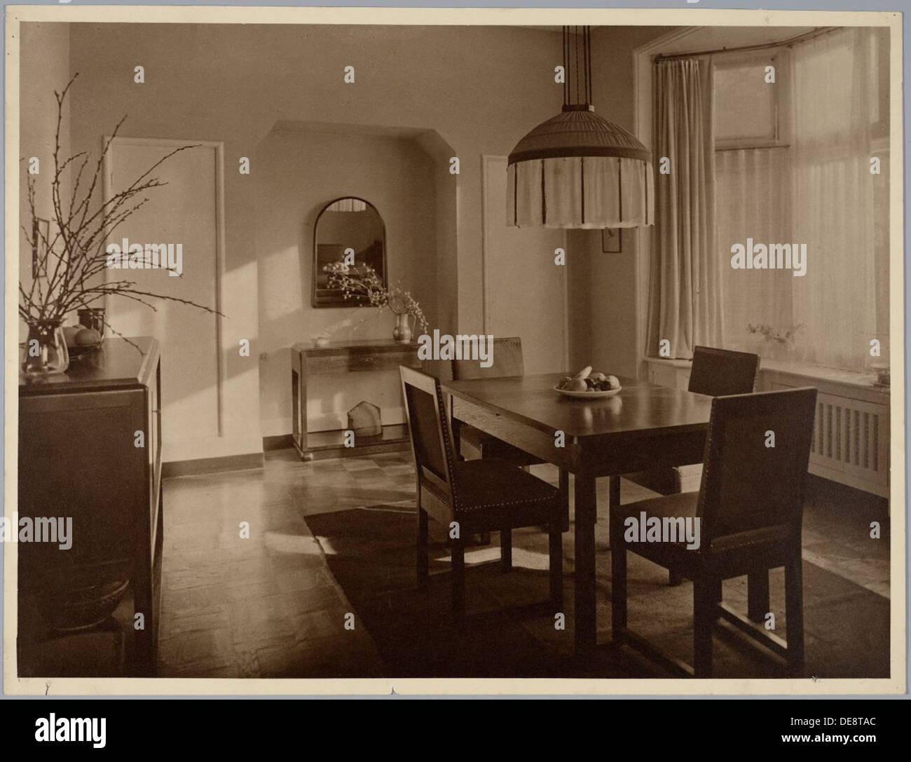 This dining room interior, designed in the 1920s-1930s, exemplifies ...
